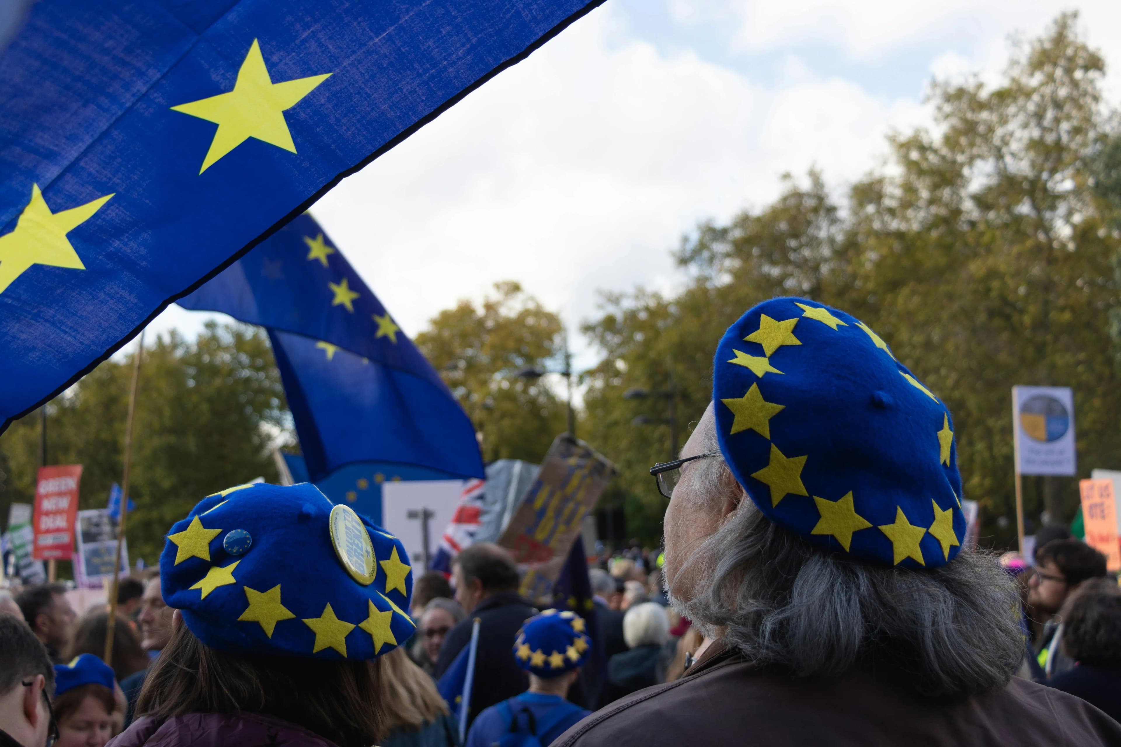 two people with eu themed hats
